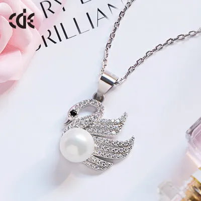 Sterling silver fancy swan with a pearl necklace