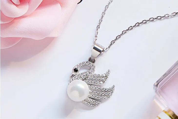 Sterling silver fancy swan with a pearl necklace