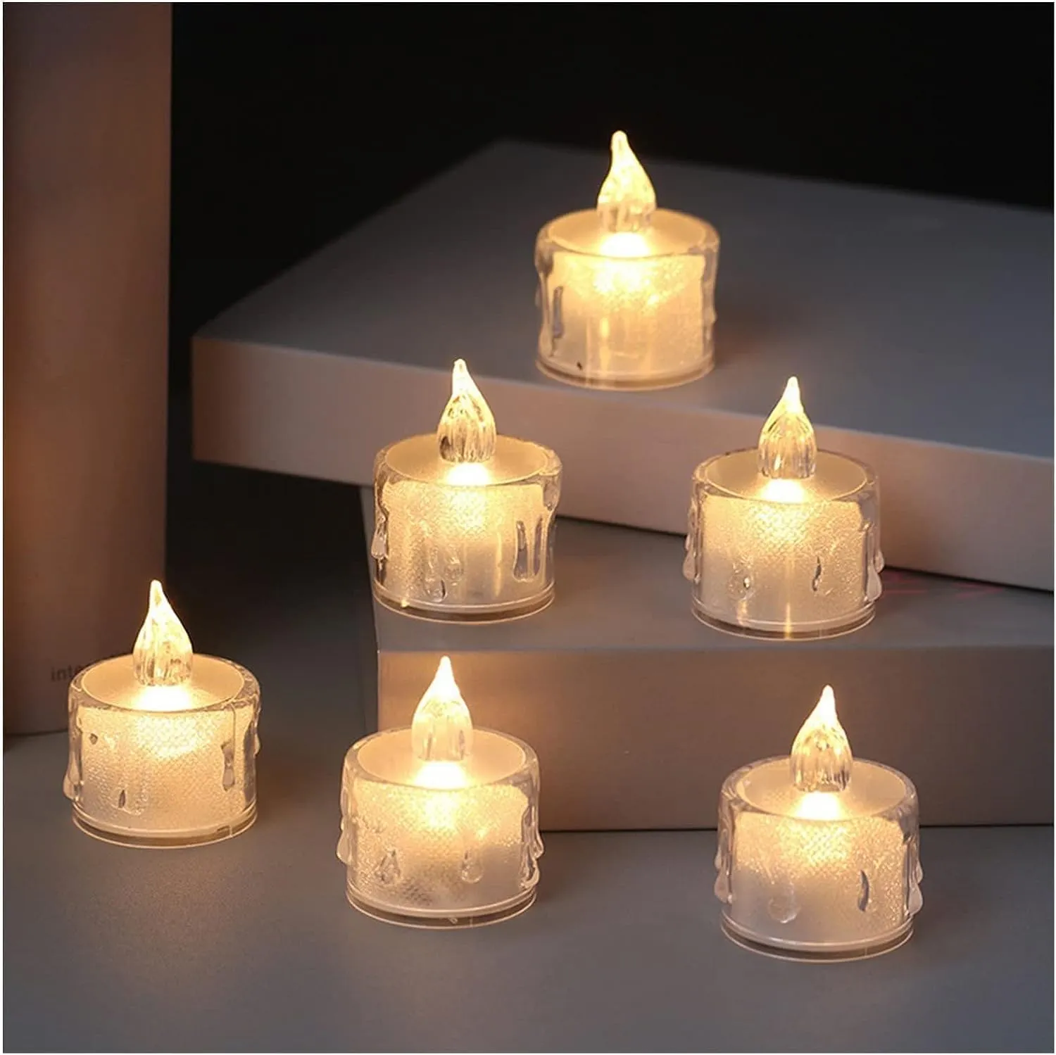 The Decor Affair 24 Pcs Flameless Electric Candles: Embrace The Spellbinding Flicker of Flickering Tea Lights, Replicating The Authentic Candlelight Effect.